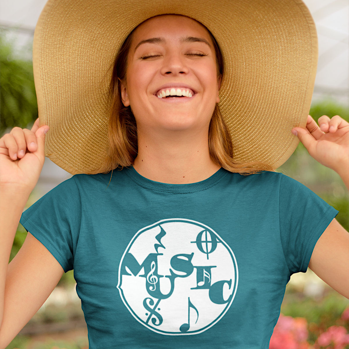 Woman in a straw hat and music-themed t-shirt